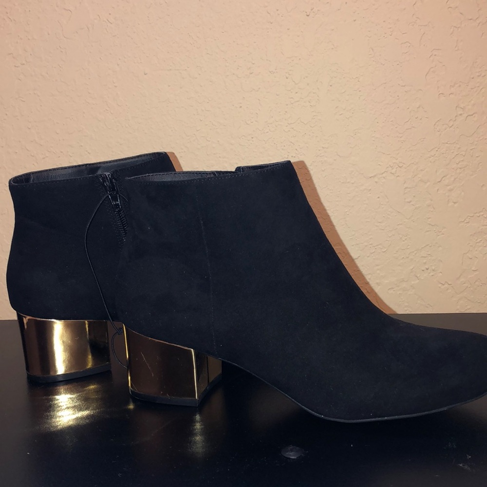 Black booties with gold heel